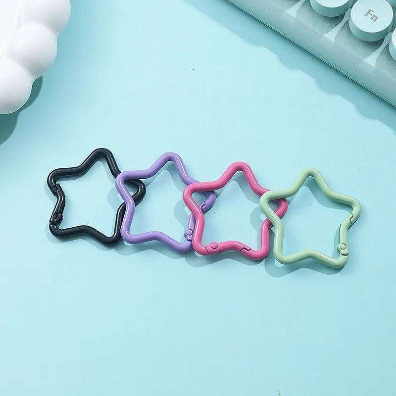 Zinc alloy five-pointed star keychain in macaron colours like light pink and green.