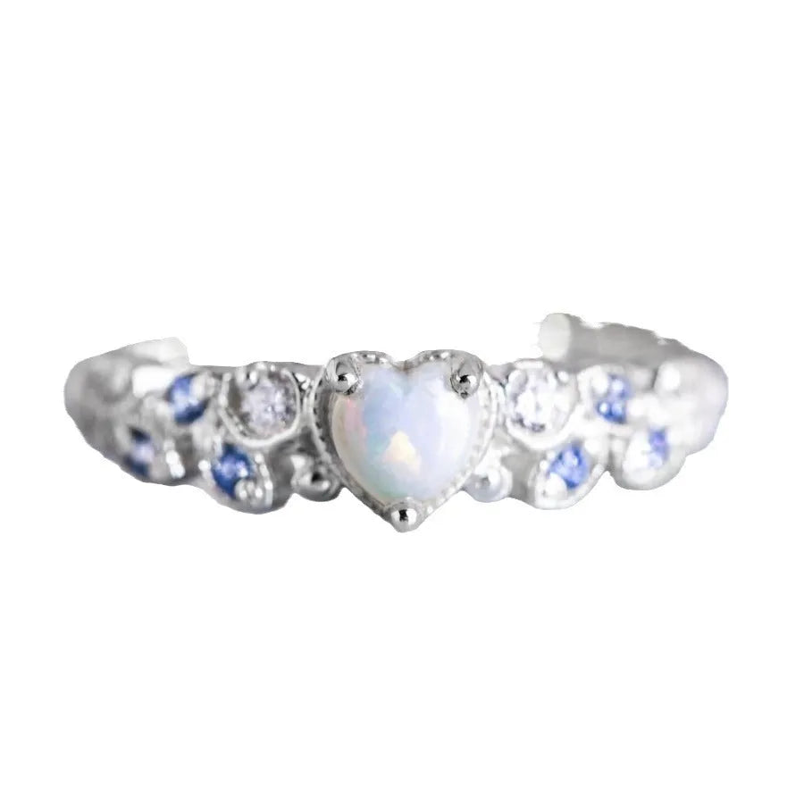 White electroplated alloy women's ring in a heart shape with floral and oceanic opal design details.