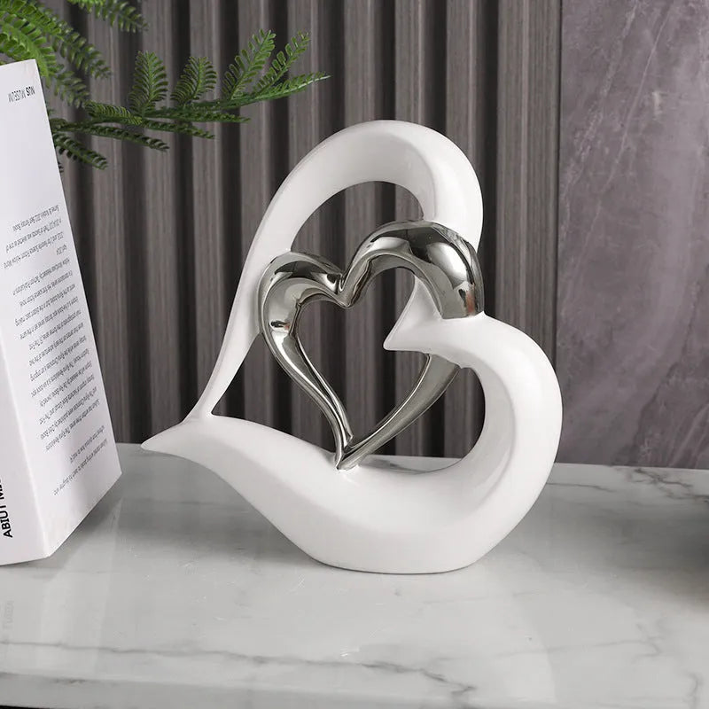 Modern white porcelain Love Heart ornament with a geometric design in a metallic gold finish.