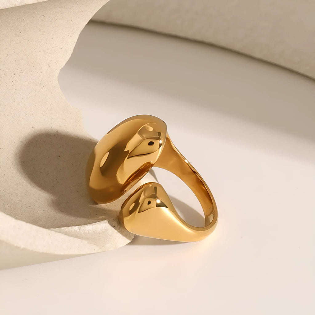 Exaggerated geometric open ring for women in stainless steel with a metallic finish.