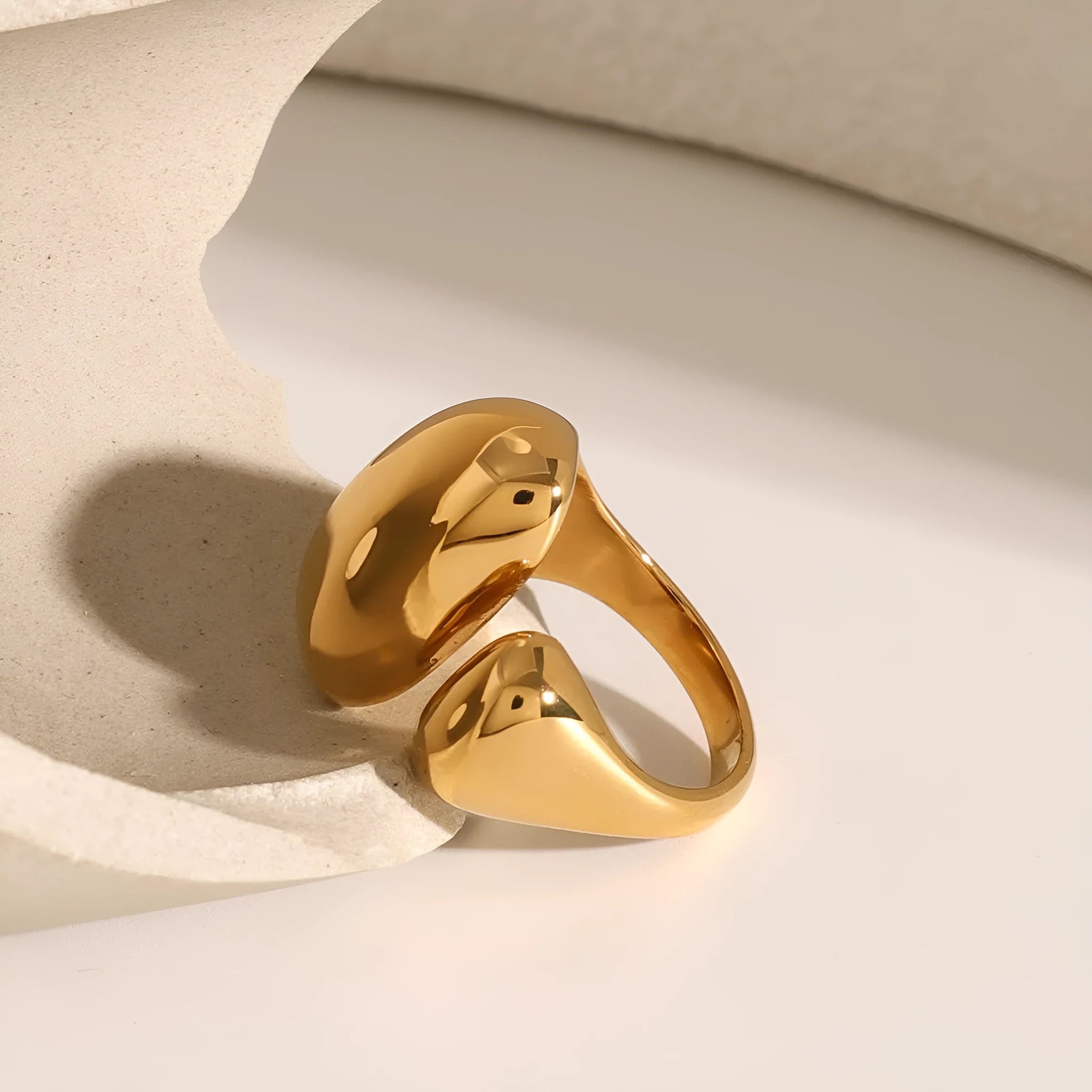 Exaggerated geometric open ring for women in stainless steel with a metallic finish.