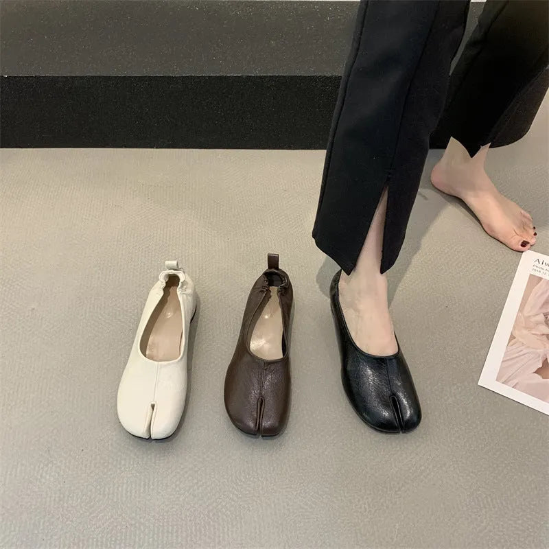 Women's apricot chunky heel pumps with a round toe and distinctive split toe horseshoe design.