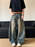 Men's retro blue distressed denim wide-leg trousers showing slim fit and vintage detailing