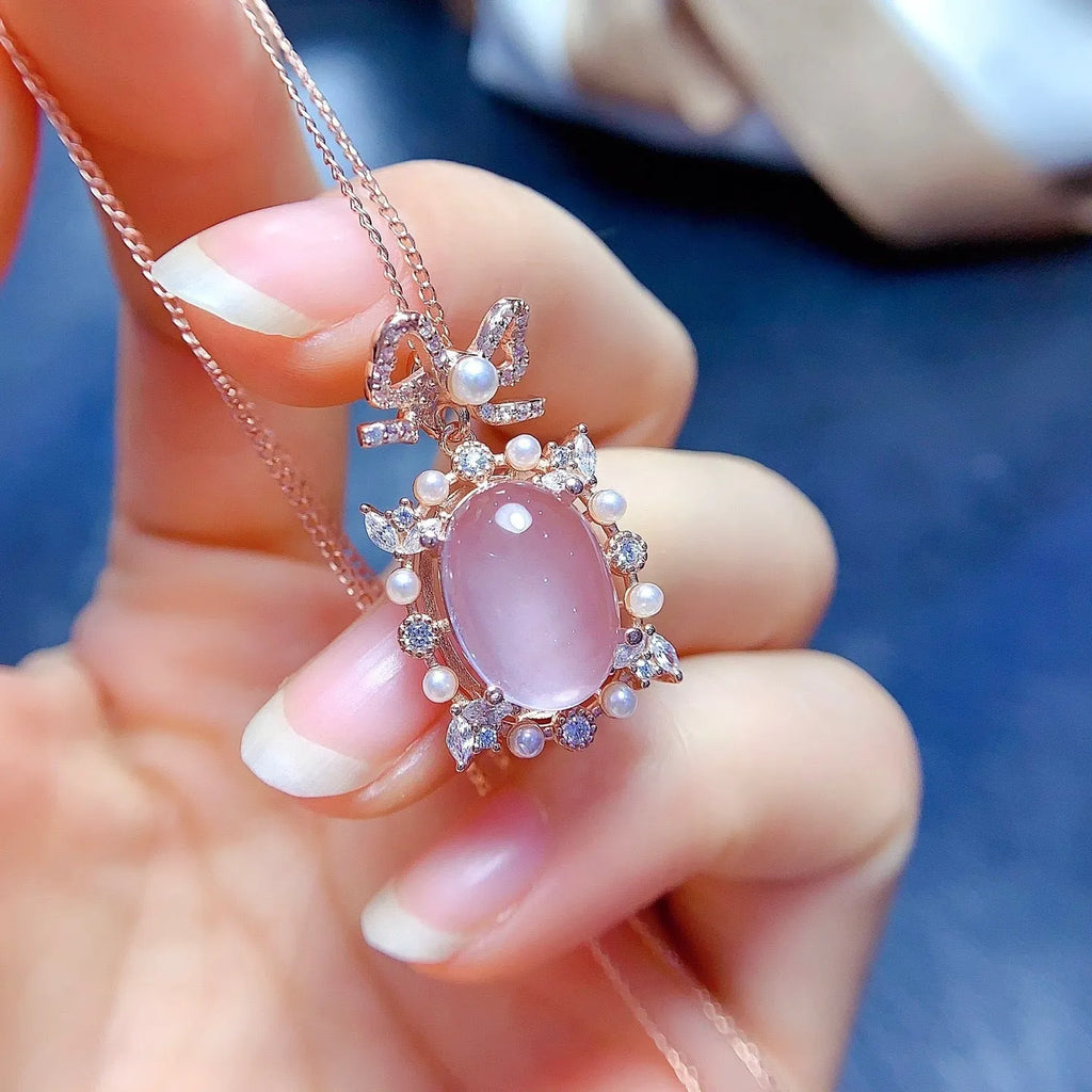 Geometric pendant necklace with pink rose quartz crystal in rose gold plated 925 silver setting.