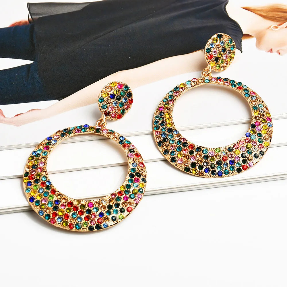 Colourful large round pendant drop earrings with cartoon style and diamond accents on metal alloy.