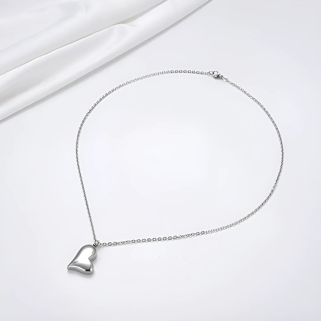 Silver curved peach heart pendant necklace on stainless steel chain with love pattern
