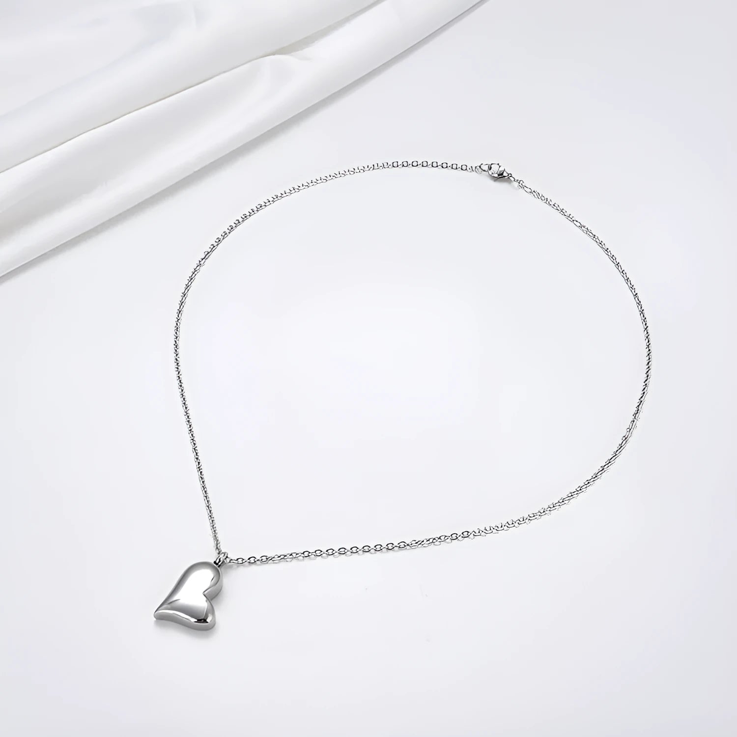 Silver curved peach heart pendant necklace on stainless steel chain with love pattern