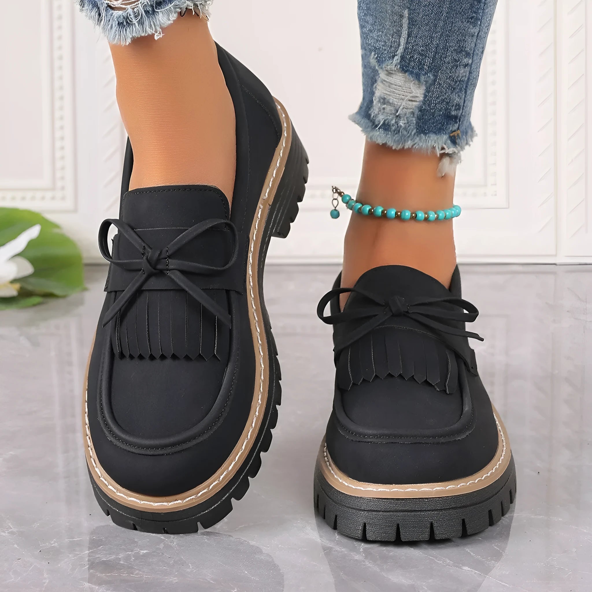 Plus size women's loafers with chunky heel in black and brown colours showing round toe design