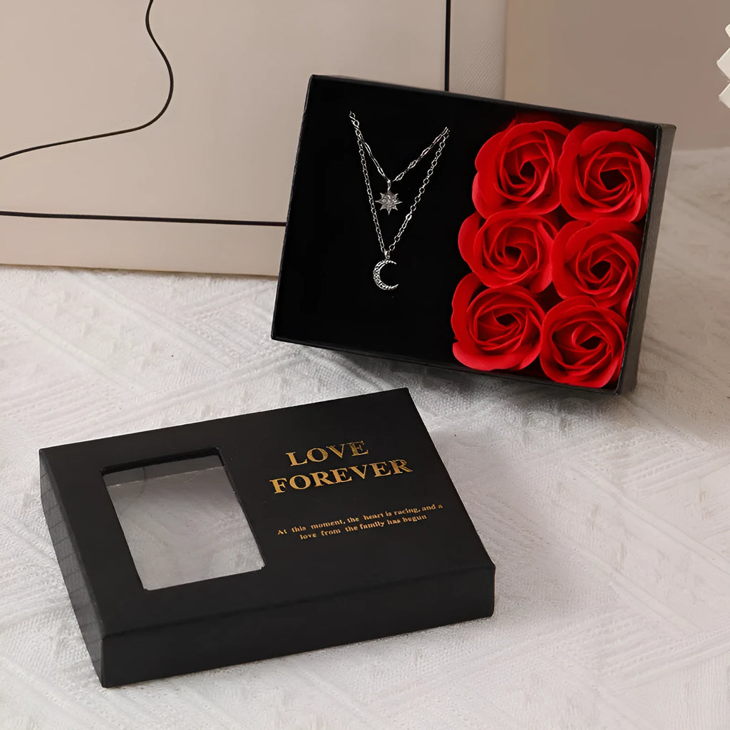 Red Korean style gift box open to show six pink soap flowers, with a matching handbag, for Valentine's Day.