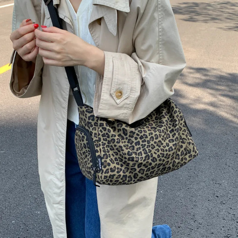 Large leopard print sports messenger bag with stripes design and cross-body strap