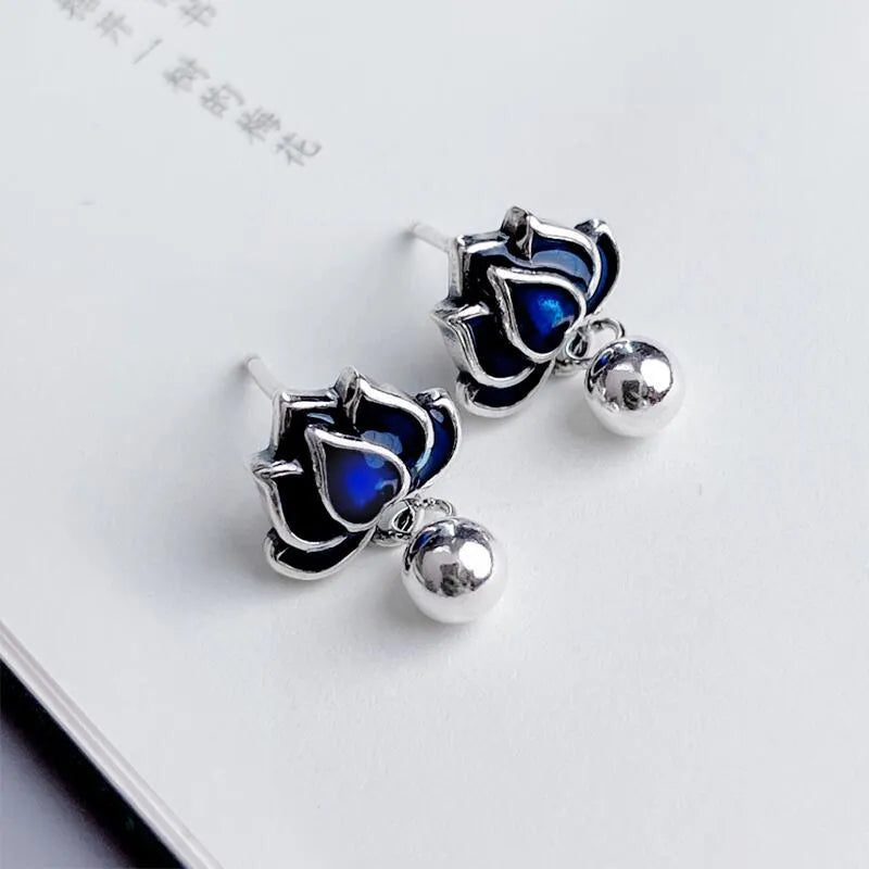Blue Lotus earrings with lotus flower stud and seedpod tassel in vintage artistic style