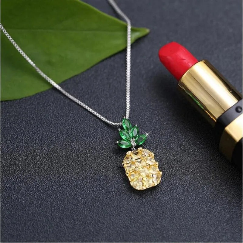 Silver plated women's necklace with a geometric pineapple diamond charm.