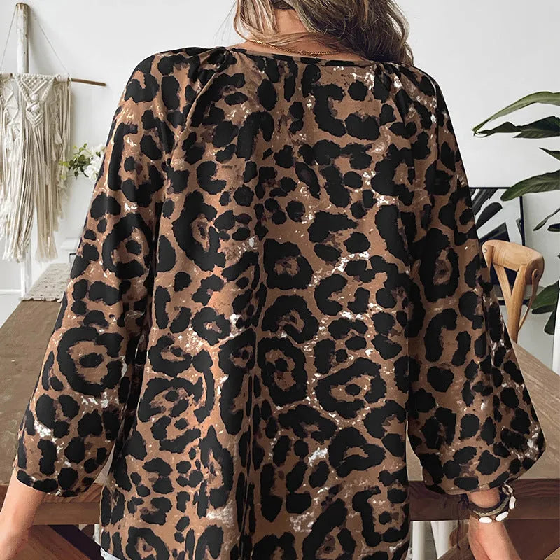Women's leopard print half sleeve V-neck pullover top with pleating detail