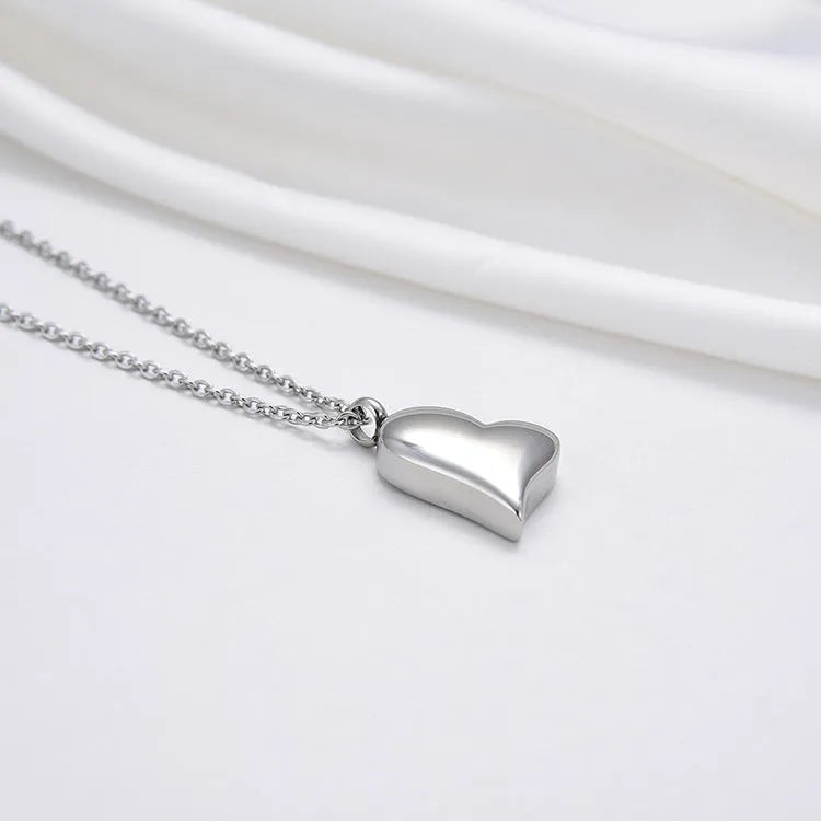 Silver curved peach heart pendant necklace on stainless steel chain with love pattern