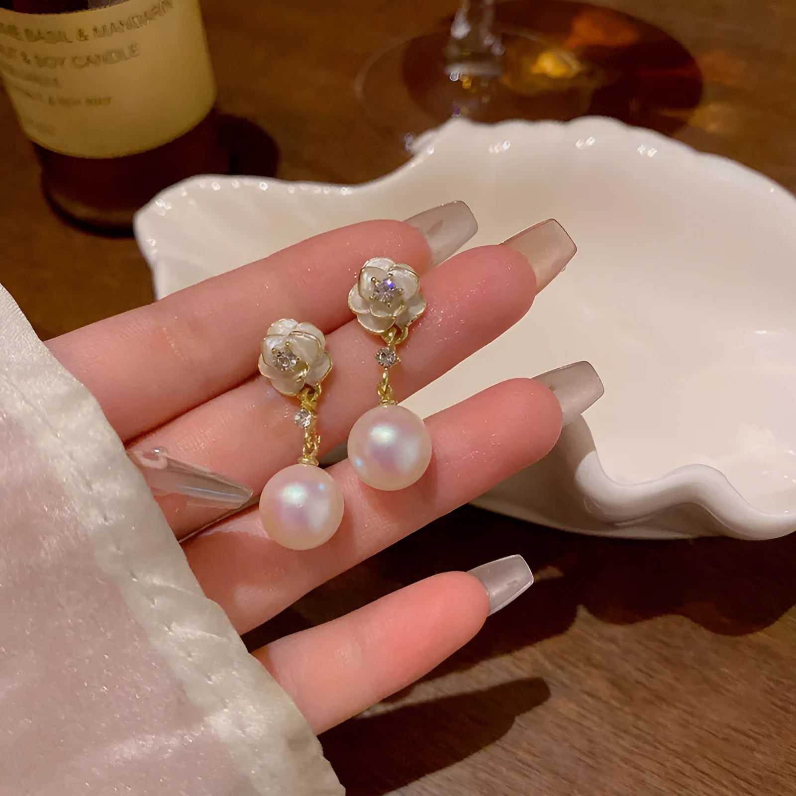 Camellia flower-shaped alloy stud earrings for women with floral design