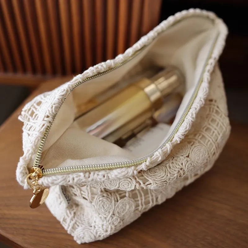 Handmade corduroy cosmetic bag with crocheted hollow flower pattern and ethnic embroidery in solid colour rope style