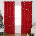 Red snowflake pattern shade cloth curtain with lace loops hanging against window