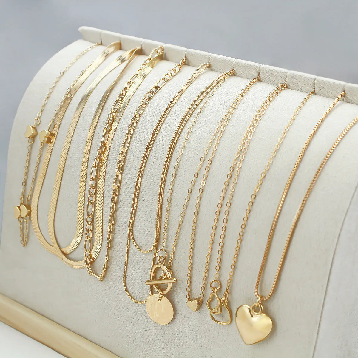 Women's 10 piece necklace set with gold electroplated finish and snake bone chain design