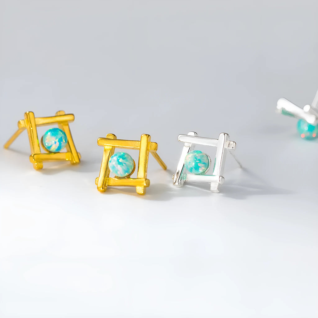 Women's geometric cross shaped stud earrings in 925 sterling silver with a choice of gold or silver finish.