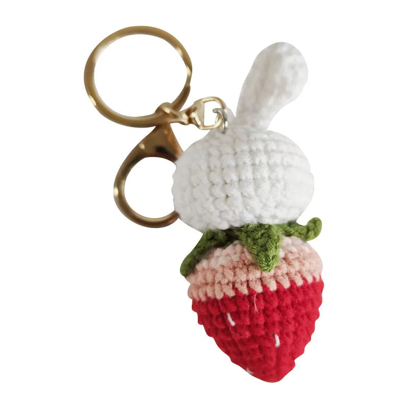 White hand-woven rabbit strawberry pendant charm with key attachment on four-strand doll wire