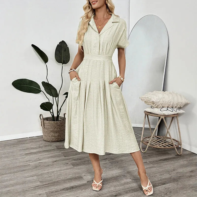 Light green women's shirt dress with lapel collar, waist tie, and side pockets.
