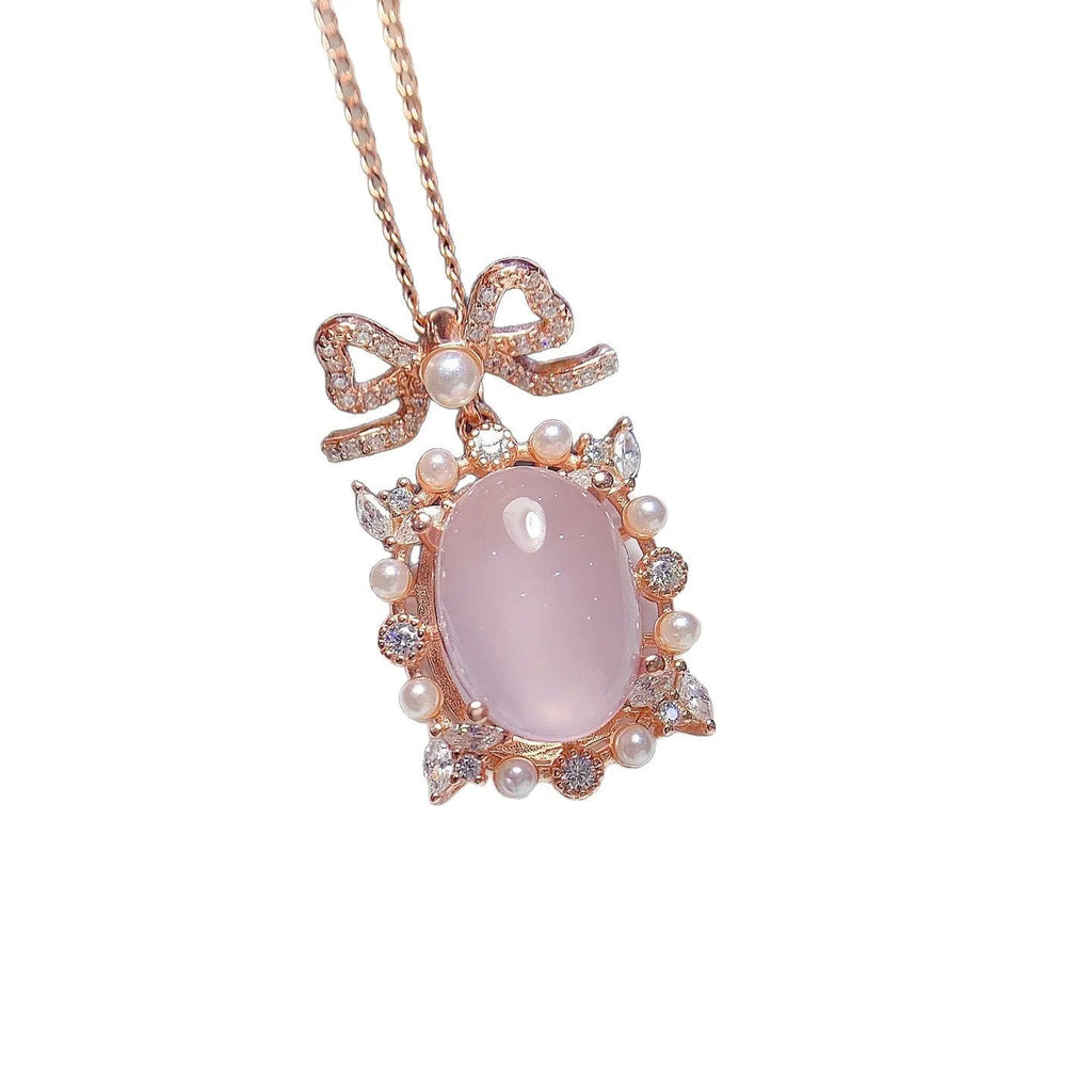Geometric pendant necklace with pink rose quartz crystal in rose gold plated 925 silver setting.