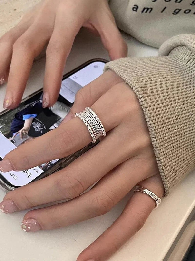 Adjustable copper alloy ring with woven twisted multilayer geometric design