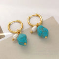 A pair of geometric copper ear clips with irregular turquoise cultured pearls, shown in short and long style options.