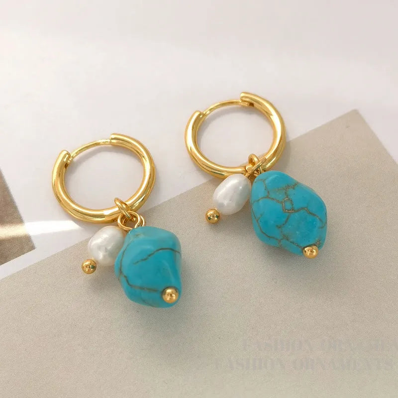 A pair of geometric copper ear clips with irregular turquoise cultured pearls, shown in short and long style options.