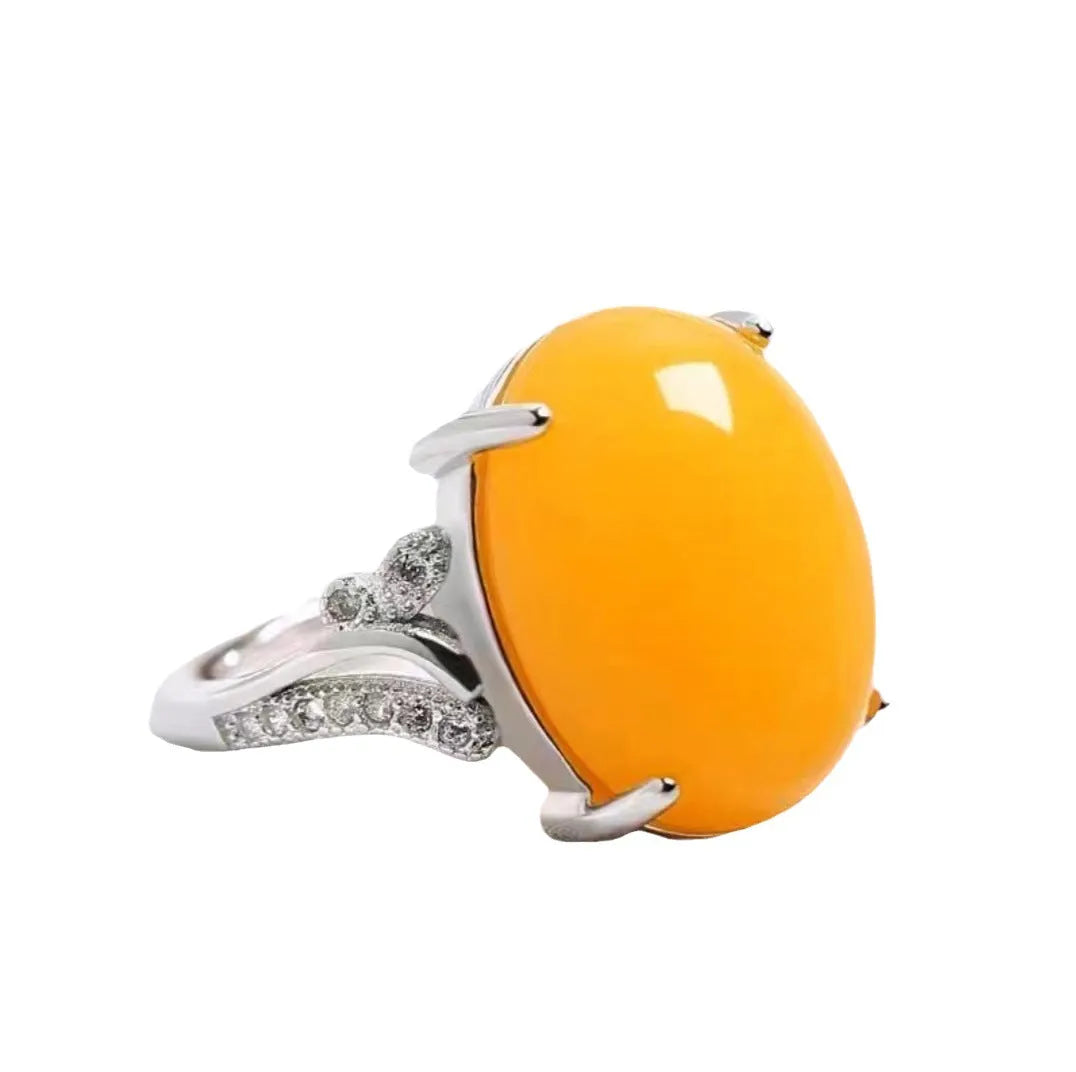 Adjustable alloy ring with geometric ethnic pattern in multiple colour options on a finger.