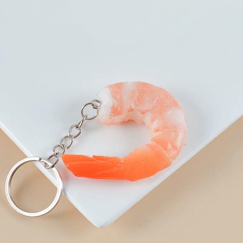 PVC injection moulded shrimp-shaped keychain pendant with door buckle, 1.5cm thick.