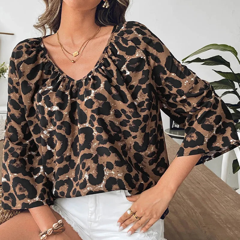 Women's leopard print half sleeve V-neck pullover top with pleating detail