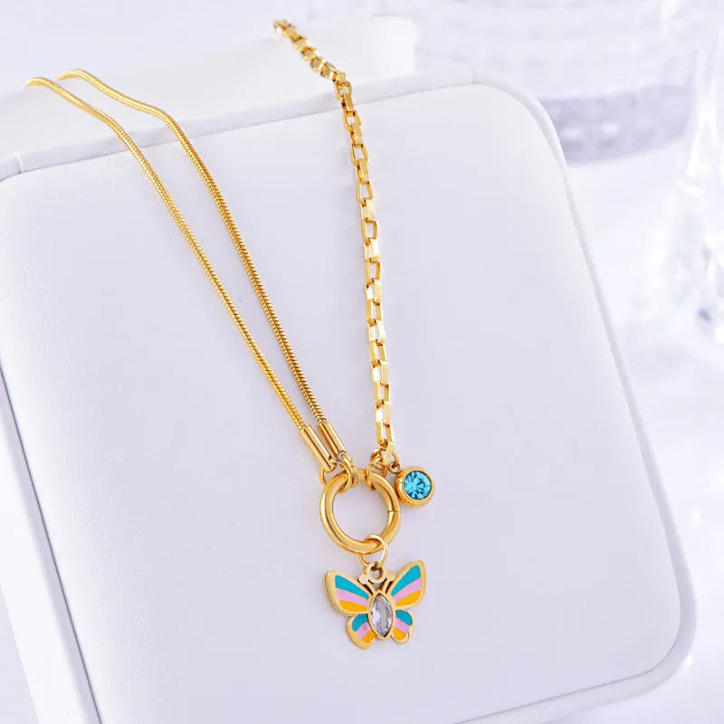 Gold-coloured epoxy butterfly necklace and bracelet set with titanium steel snake bones chain