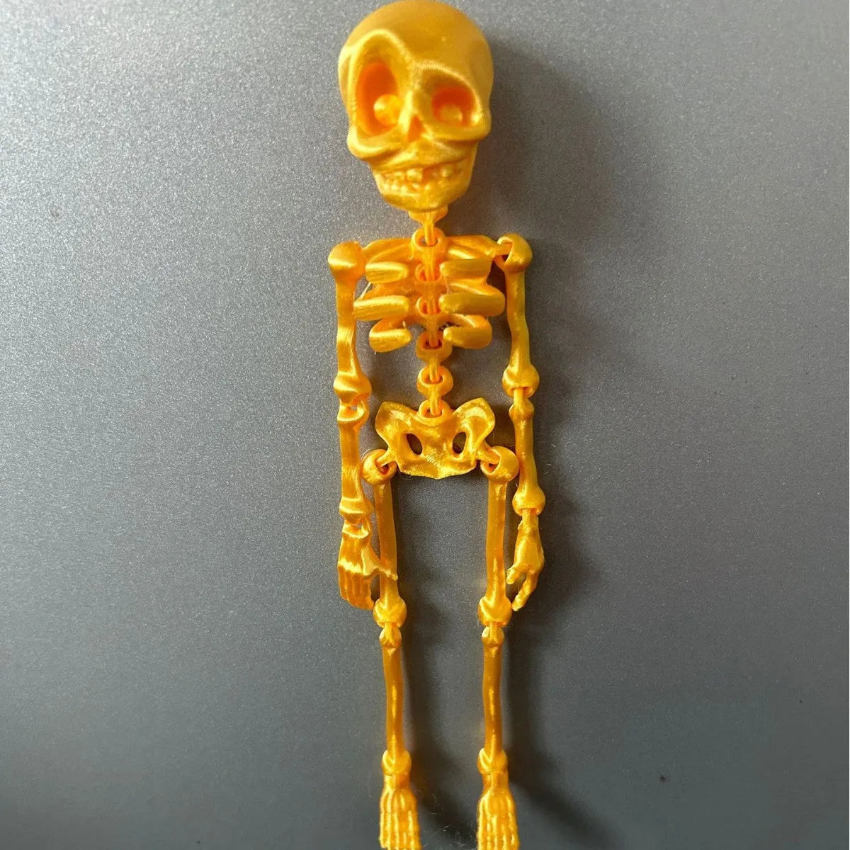 3D printed white skull refrigerator magnet ornament measuring 18cm high