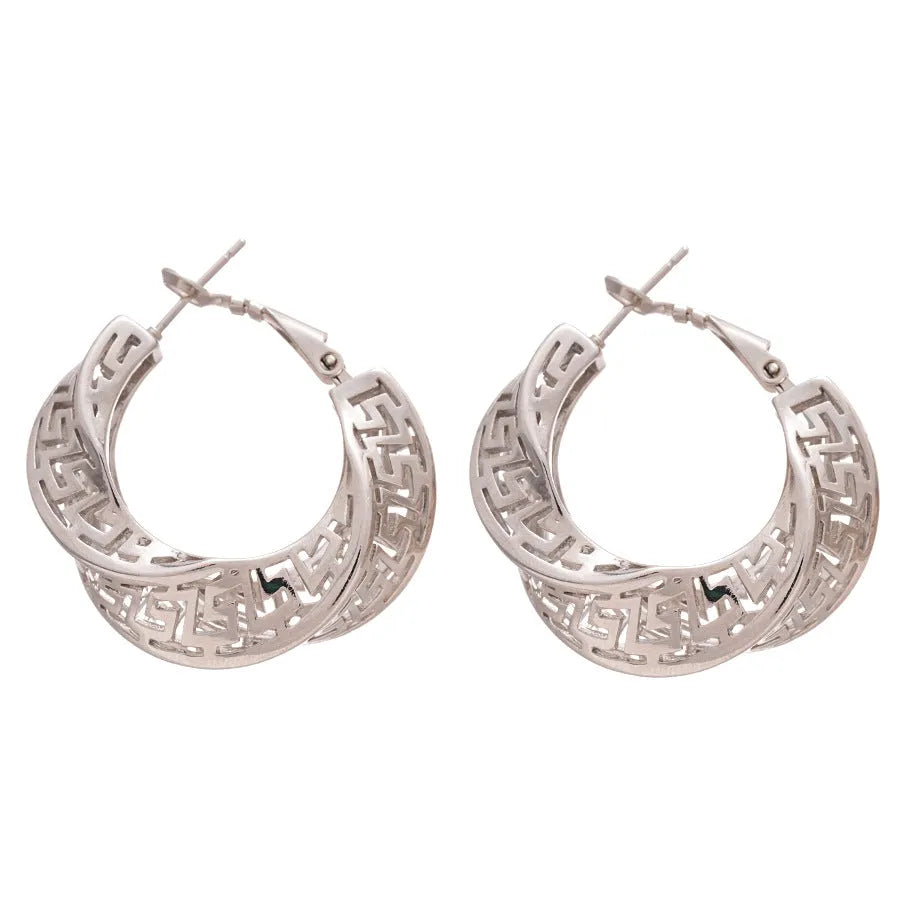 Women's geometric hollow stud earrings with twisted round shapes in gold and silver plating