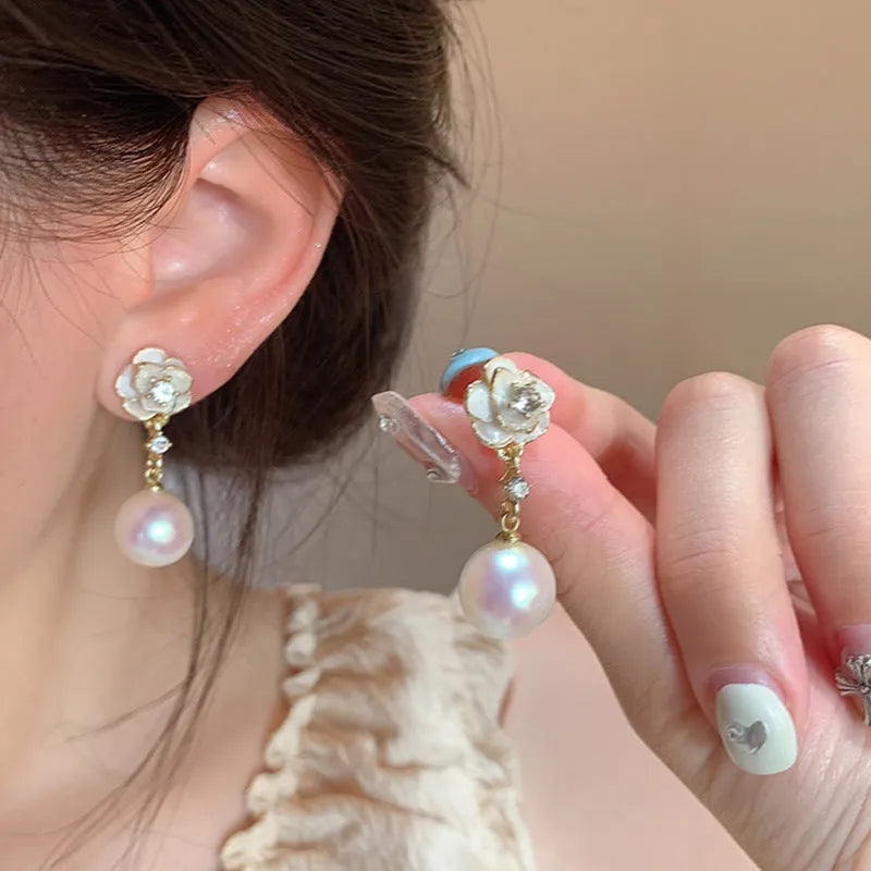 Camellia flower-shaped alloy stud earrings for women with floral design