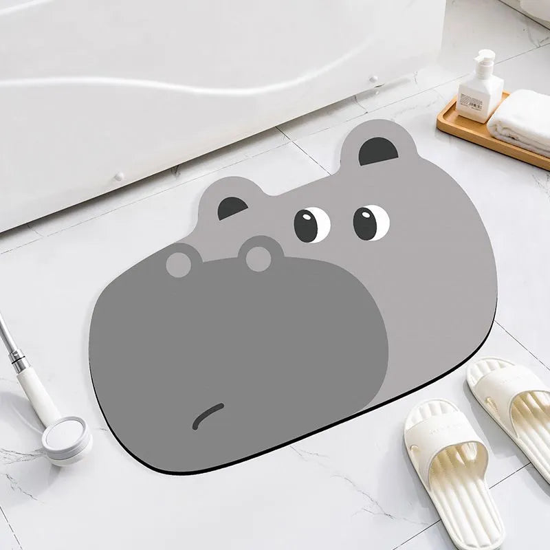Thickened diatom ooze absorbent bathroom mat with cartoon animal design on a bathroom floor.
