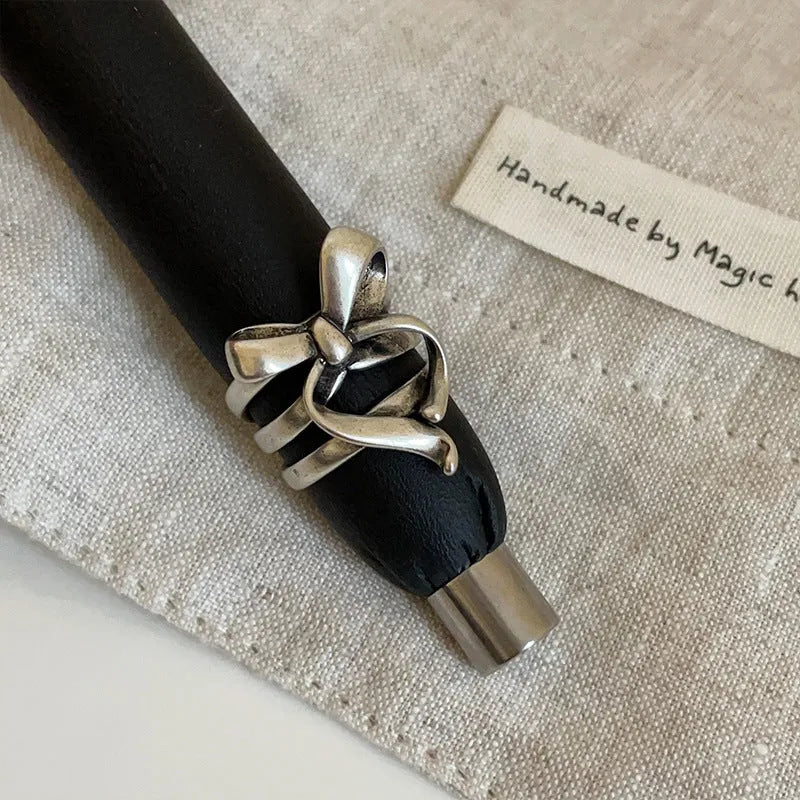 Gold plated wide open ring with retro distressed bow front and geometric metal shape for women
