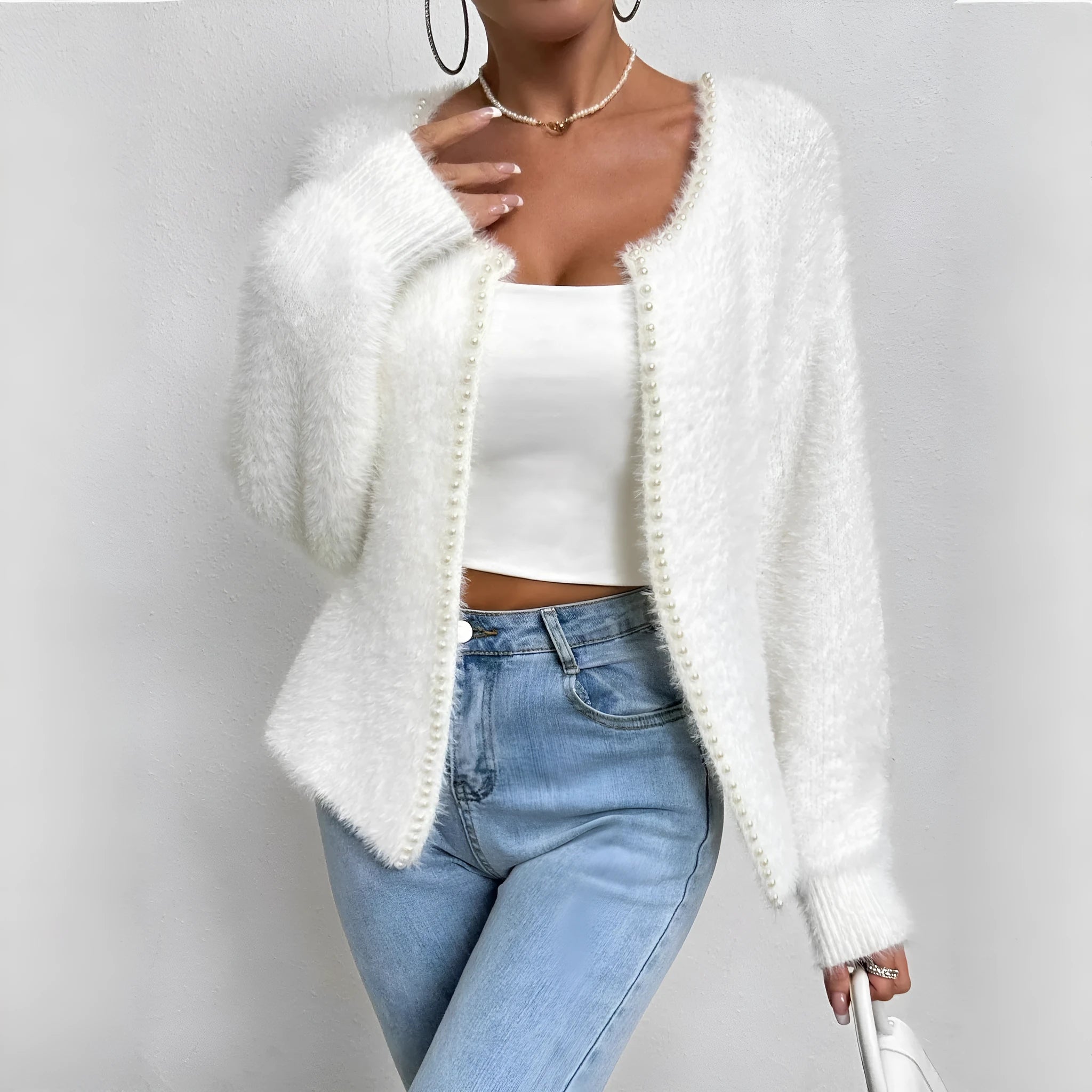 White women's V-neck cardigan with bead knit detail on medium thickness polyester fabric