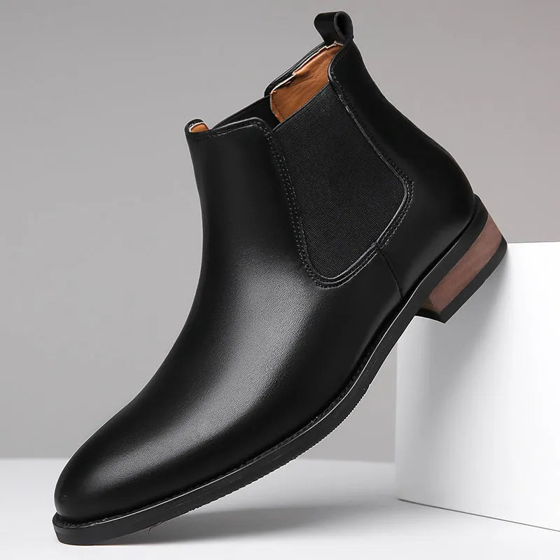 Men's black and light brown pointed toe Chelsea boots with a low heel and artificial PU upper