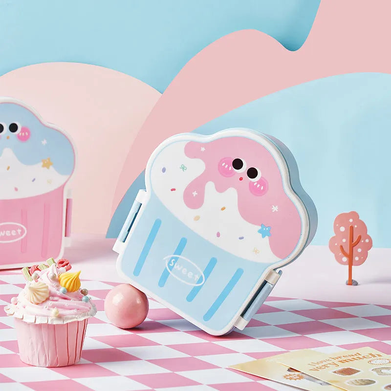Pink and blue creative ice cream shaped plastic lunch box with bento compartments and included spoon and fork.