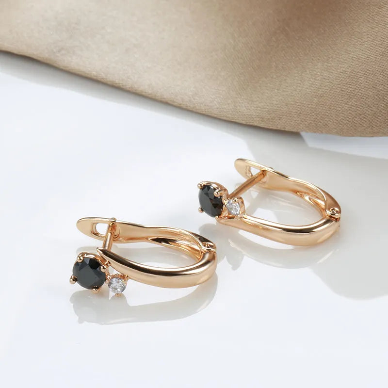 Women's black agate drop earrings with geometric design in gold-plated copper setting