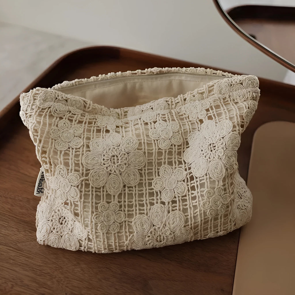 Handmade corduroy cosmetic bag with crocheted hollow flower pattern and ethnic embroidery in solid colour rope style