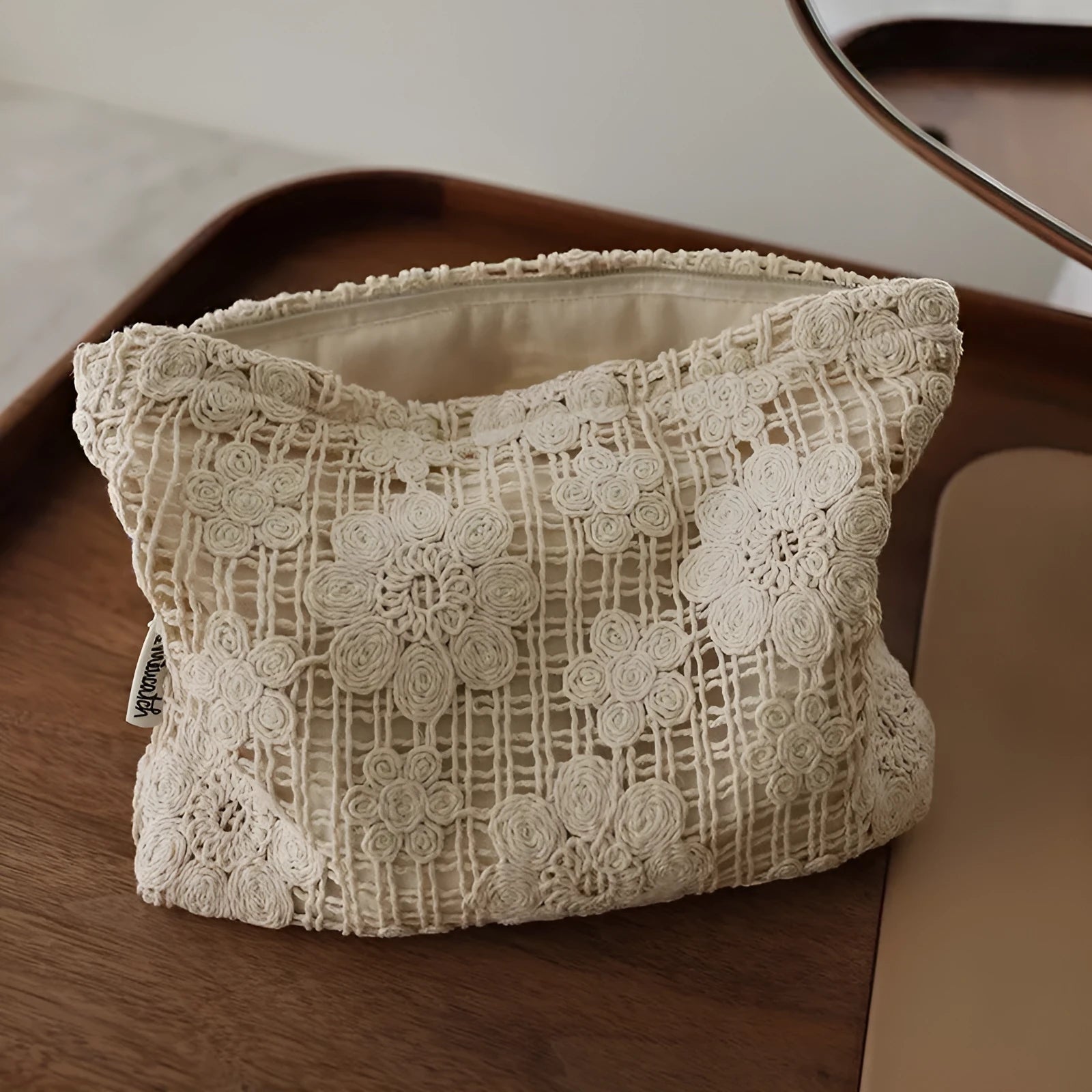 Handmade corduroy cosmetic bag with crocheted hollow flower pattern and ethnic embroidery in solid colour rope style