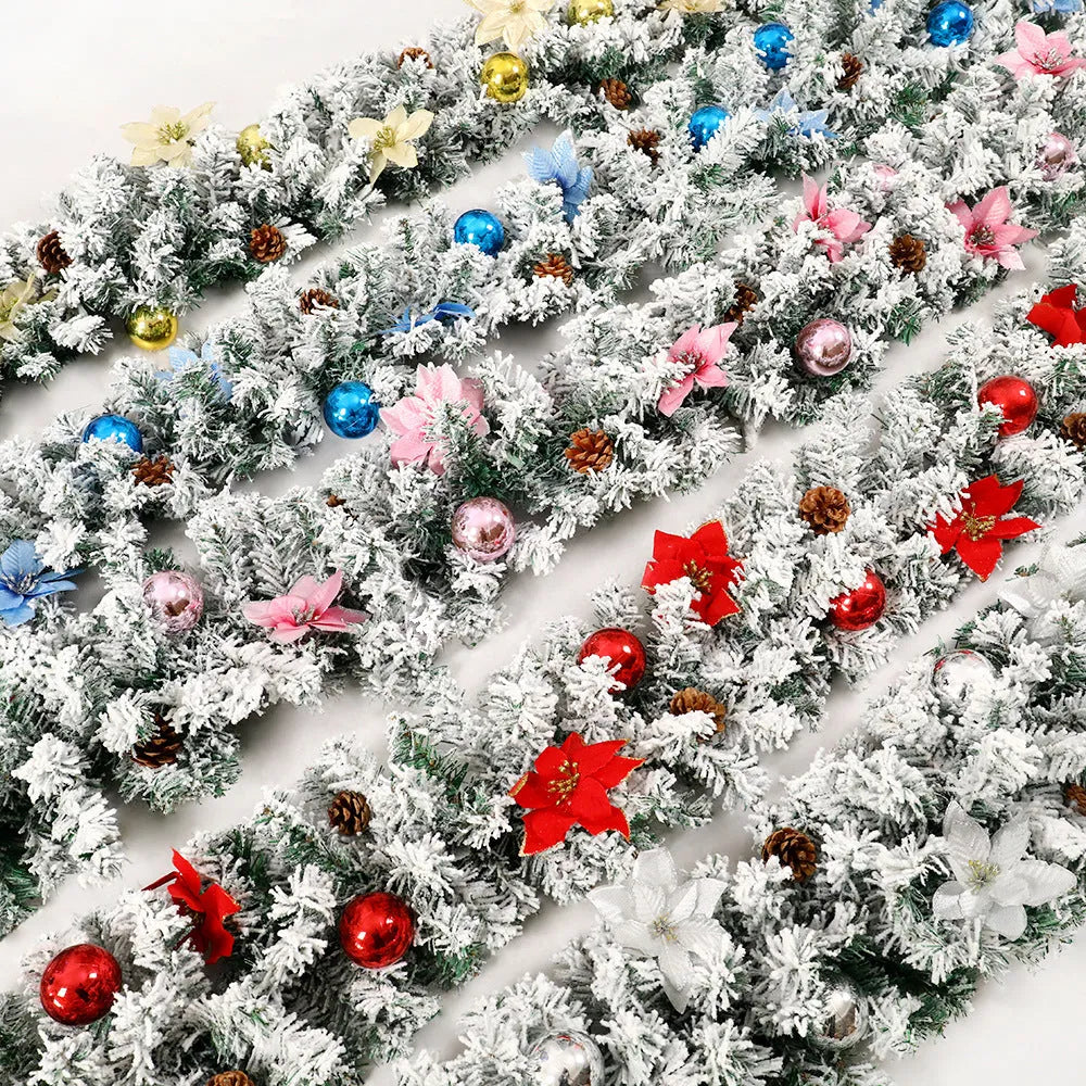 A long, flocked golden rattan Christmas garland draped in a swag on a mantelpiece.