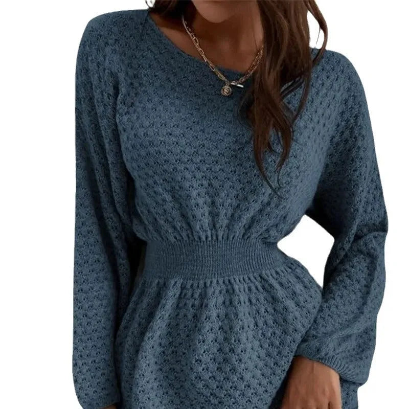 Blue women's knitted dress with hand-crocheted flowers, fitted waist, and round neck.