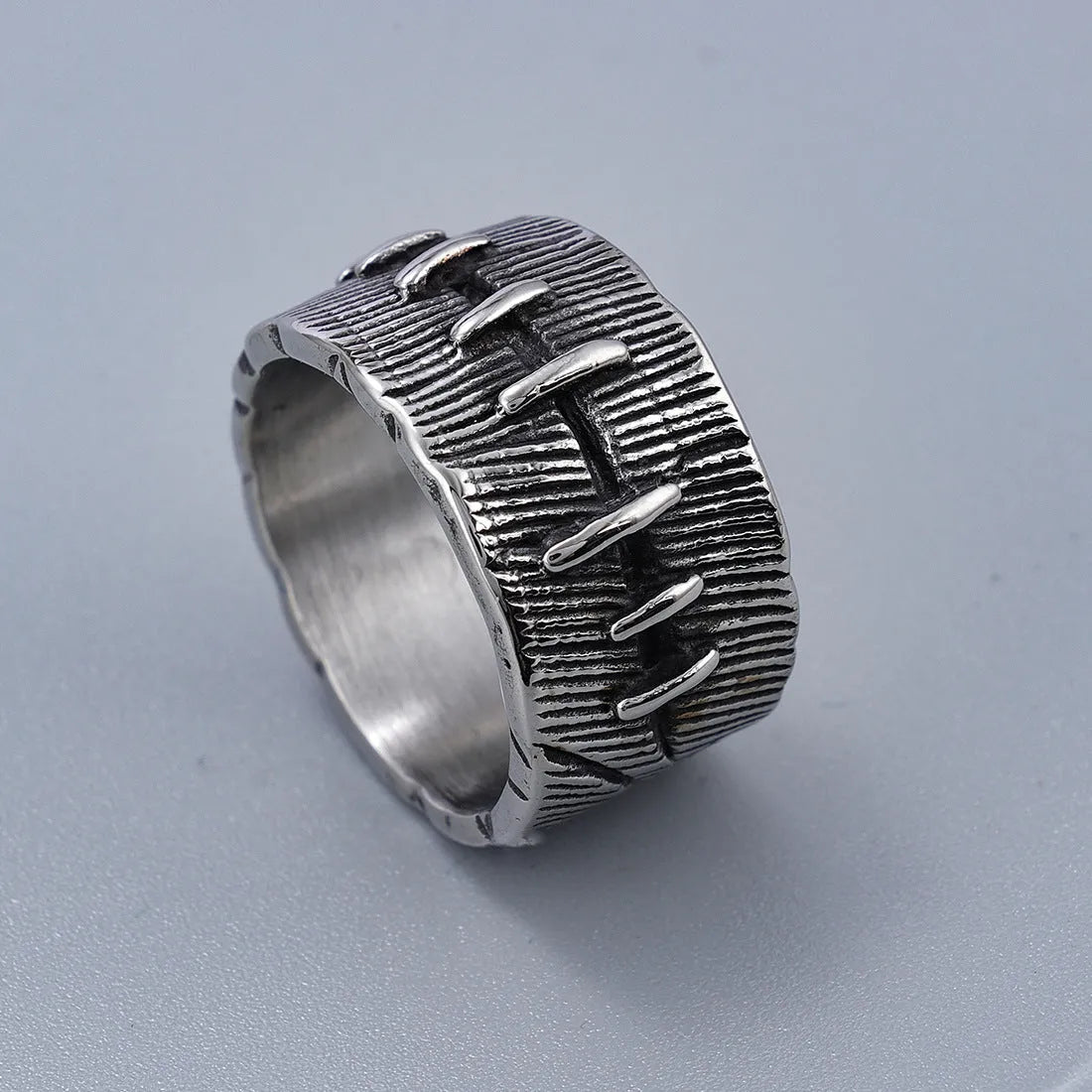 Dark punk titanium steel ring with geometric U-shape and stitched double ring design