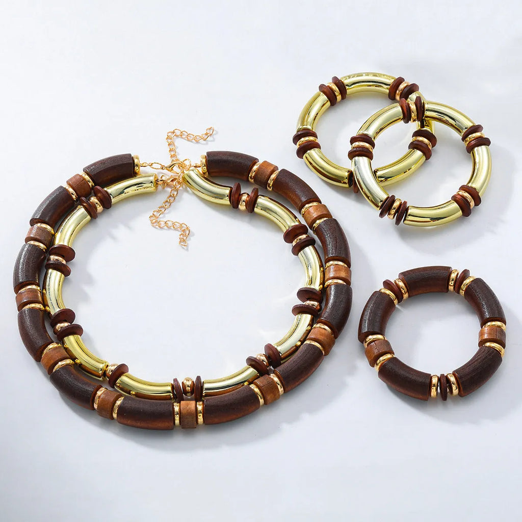 Women's exaggerated multi-layer necklace and bracelet set in alloy with round pendant elements