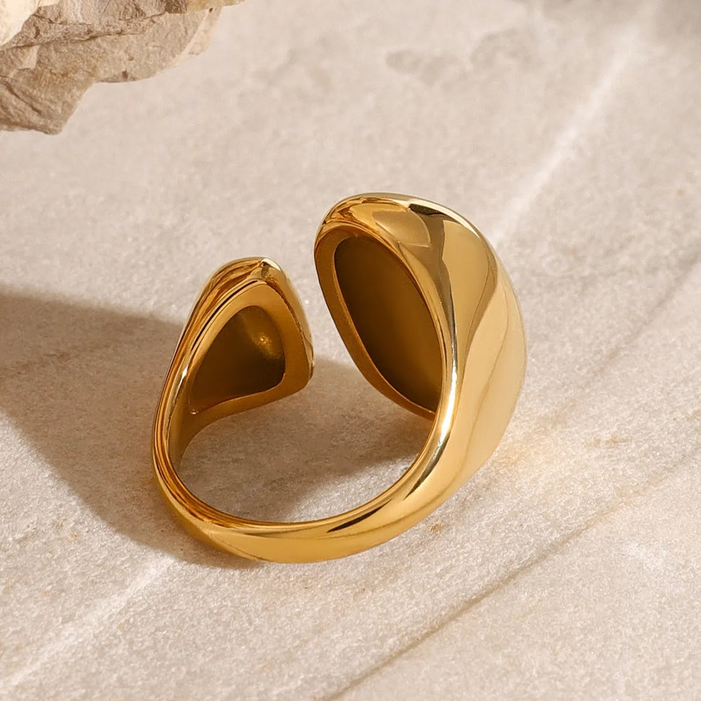 Exaggerated geometric open ring for women in stainless steel with a metallic finish.