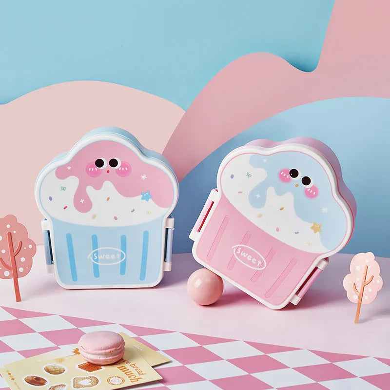 Pink and blue creative ice cream shaped plastic lunch box with bento compartments and included spoon and fork.
